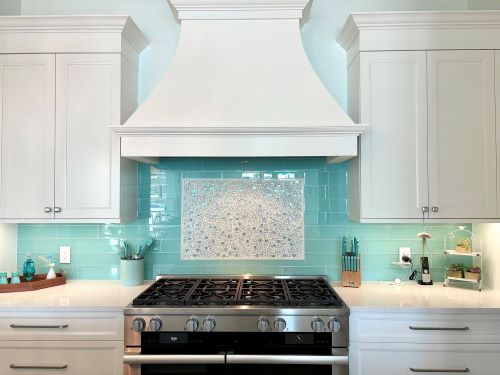 Teal and white kitchen backsplash. 